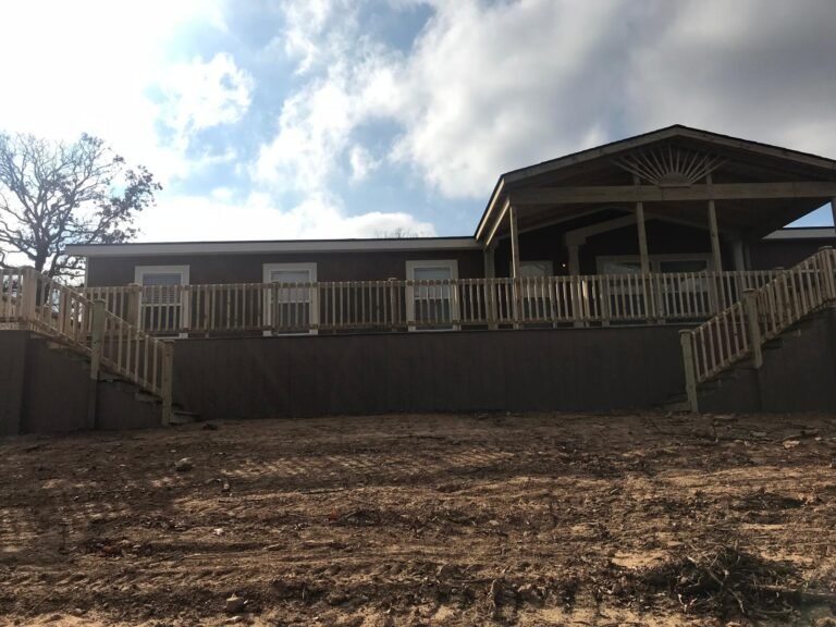 Covered deck on dark-toned home